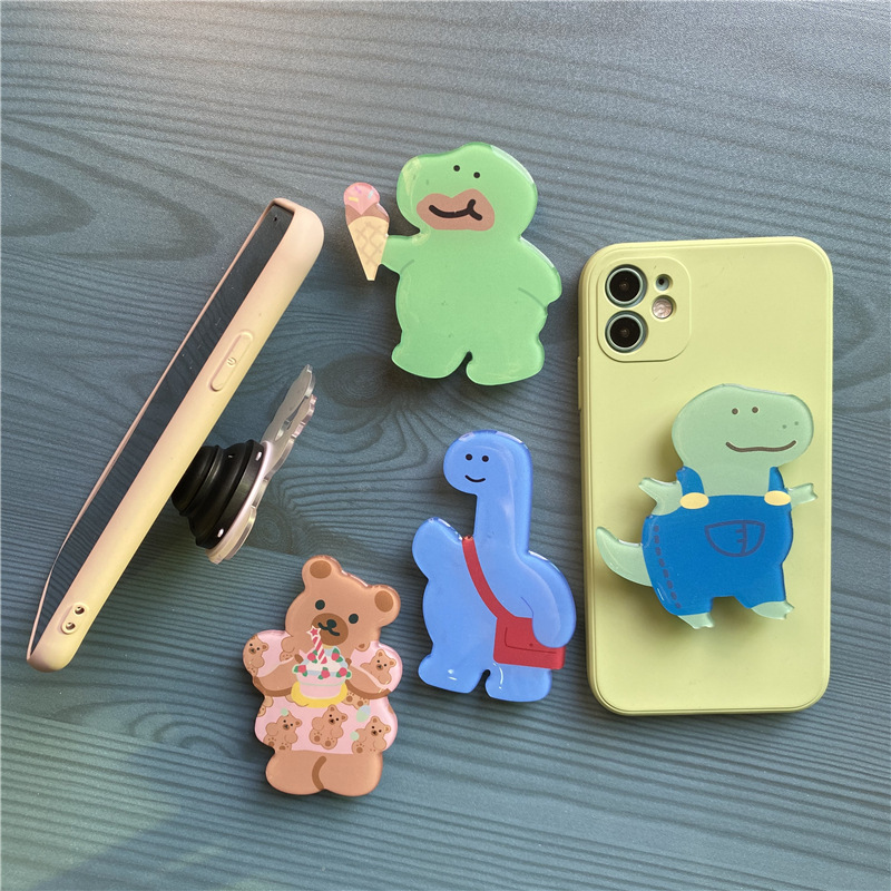 Airbag bracket foreign trade creative cartoon glue drop small dinosaur lazy telescopic mobile phone bracket gift LOGO wholesale