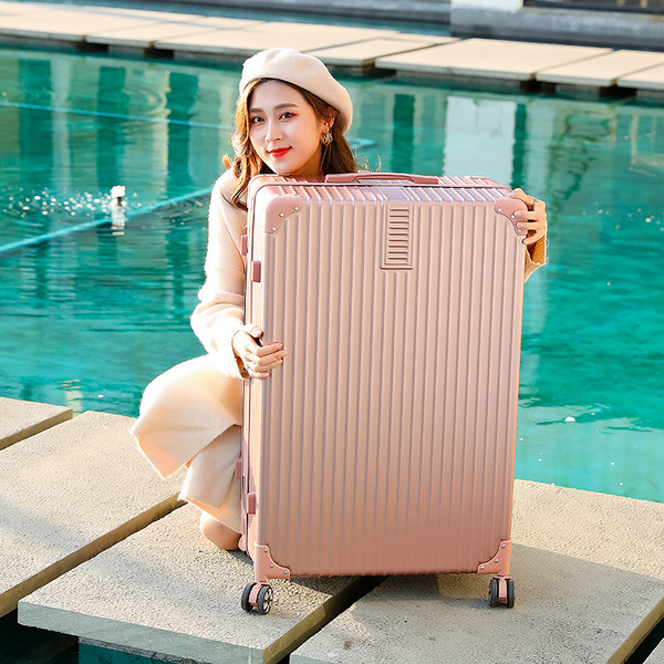 Big retro universal extra large suitcase on wheels