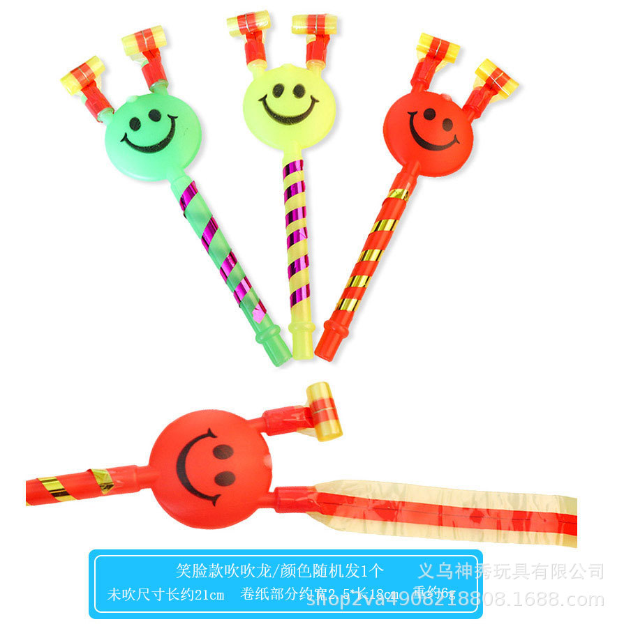 Una cara sonriente soplando Dragón