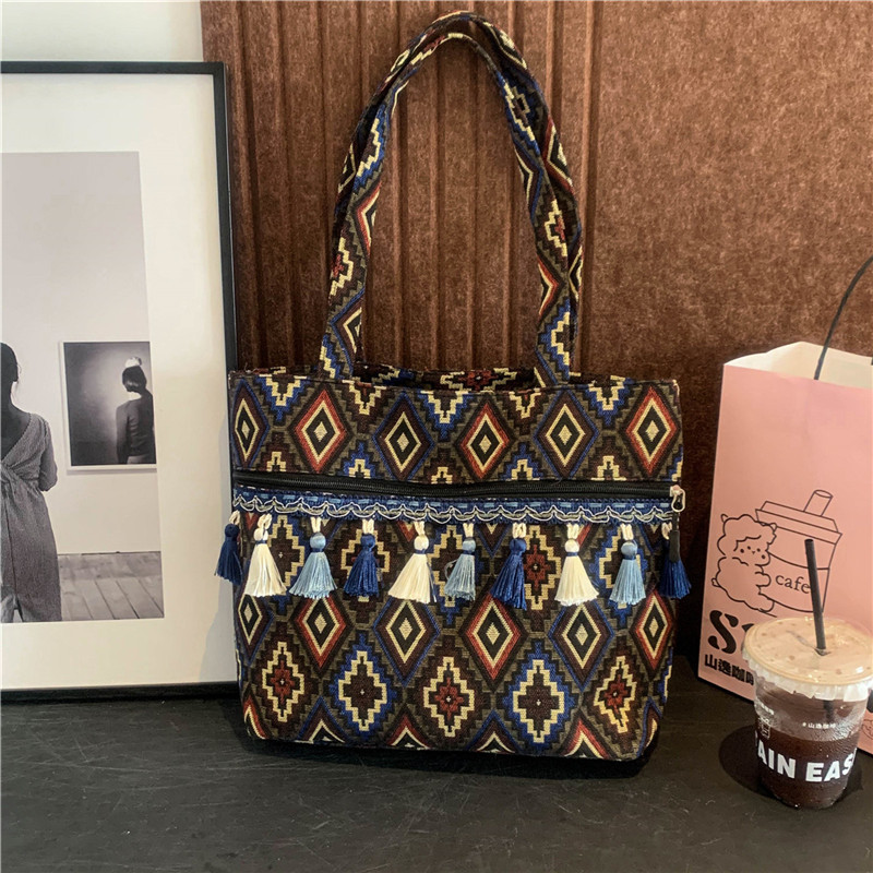 Bolsos de estilo nacional, bolsos de nicho, bolsos de hombro de estilo vacacional, bolsos de mujer, bolsos de primavera de 2025.