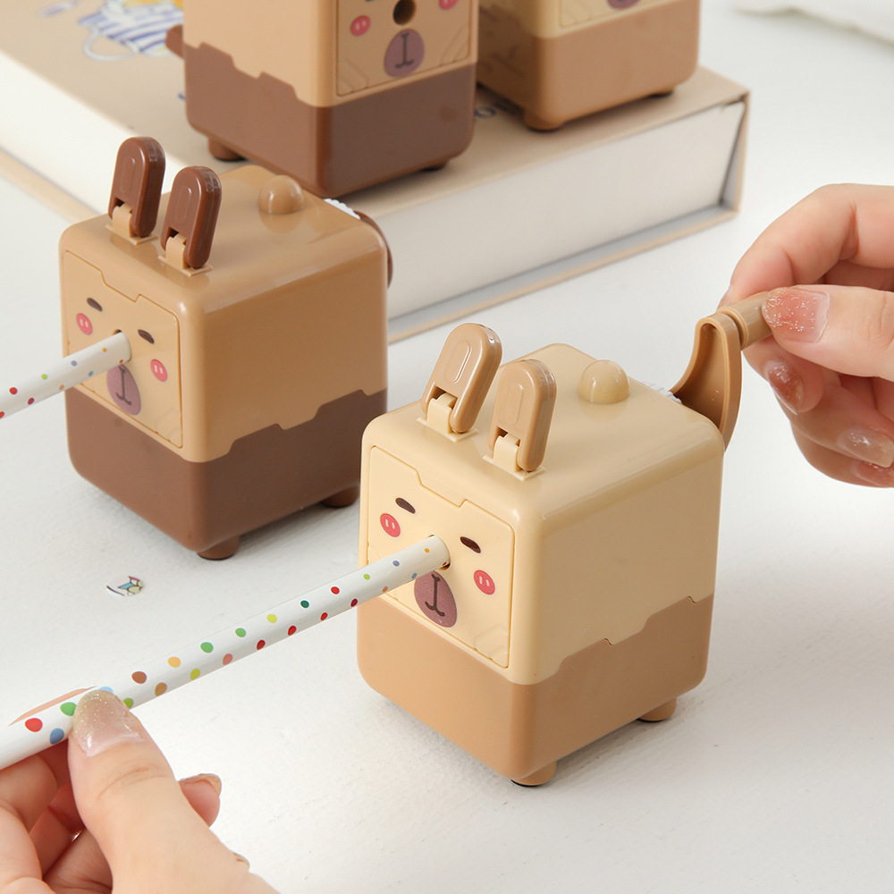 Capibara cuchillo de lápiz manual cuadrado encantador cuchillo de lápiz de Dolphin de alto valor facial para estudiantes de papelería