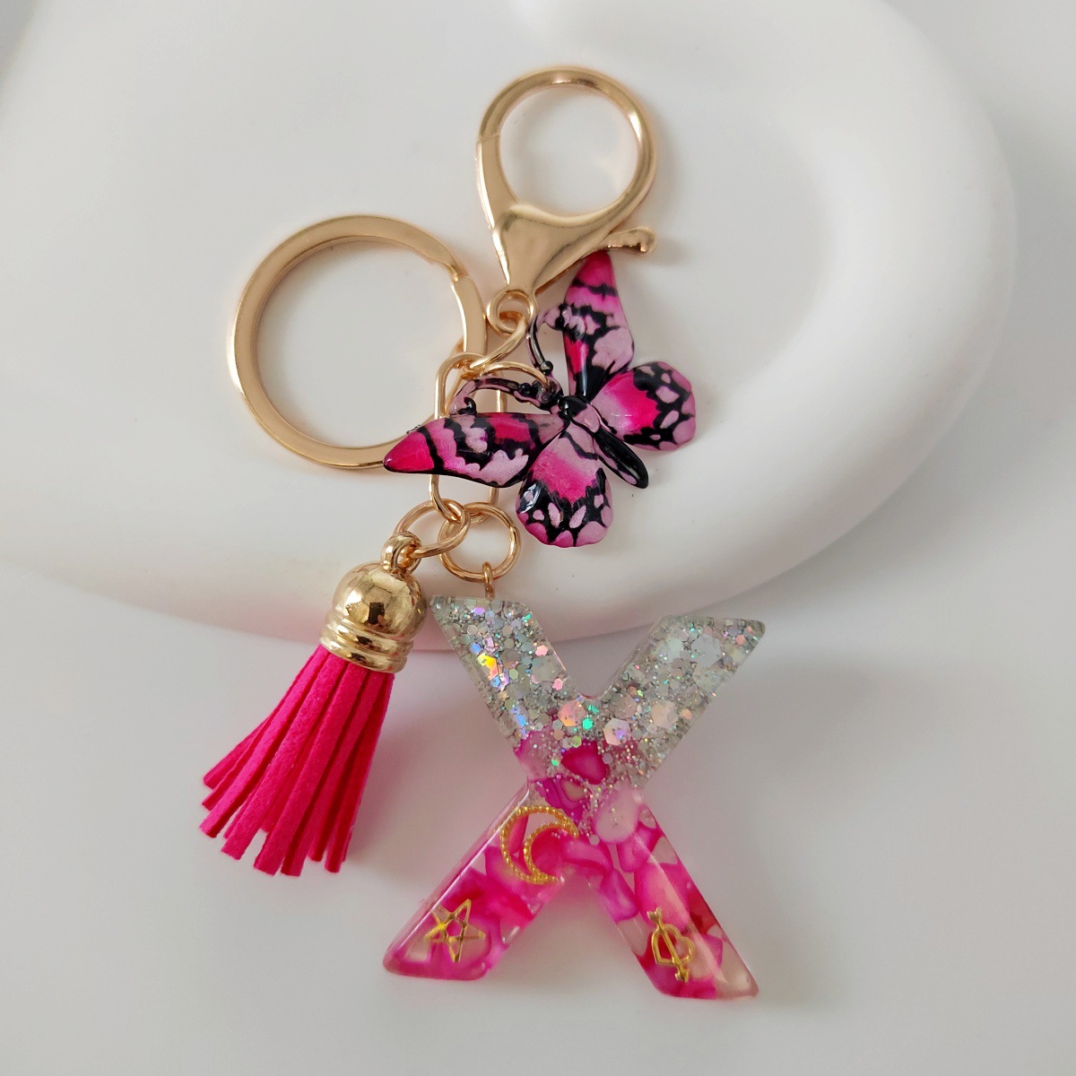 Inventario transfronterizo nueva resina bicolor mariposa borda llavero colgante estrella luna accesorios de joyas