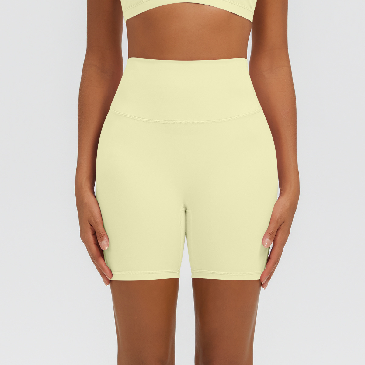 Nuevo tipo delgado de hielo, piel transpirable, ajustado, color sólido, ropa de yoga, pantalones cortos de tres puntos.