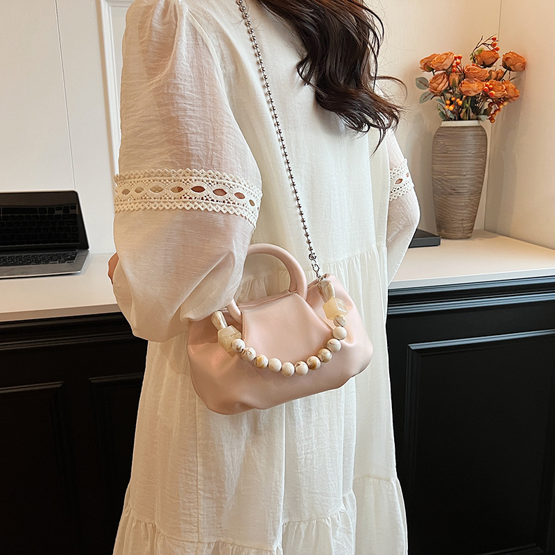 High end handbag for women in 2024, new niche design, summer handheld pleated chain strap, crossbody cloud bag_voghion.com