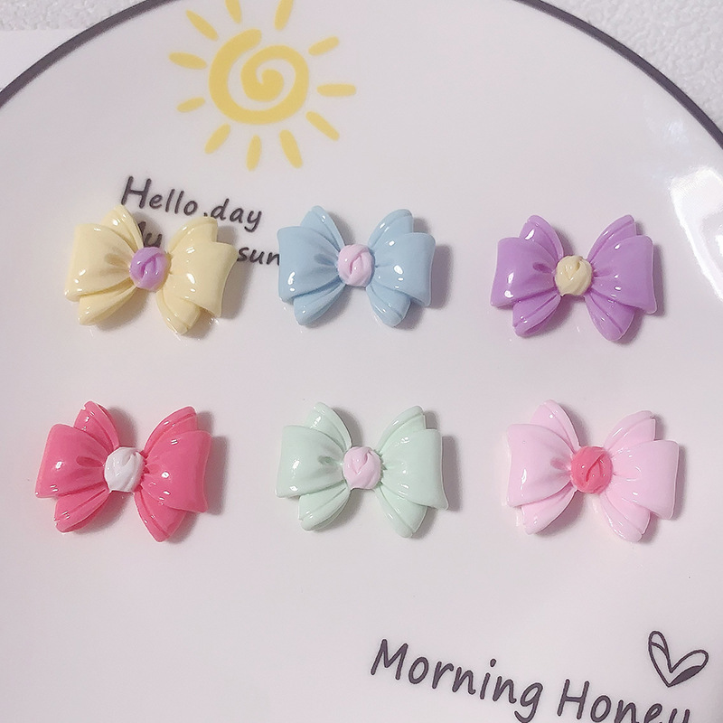 Nuevos accesorios de resina de color macaron de lazo de dibujos animados