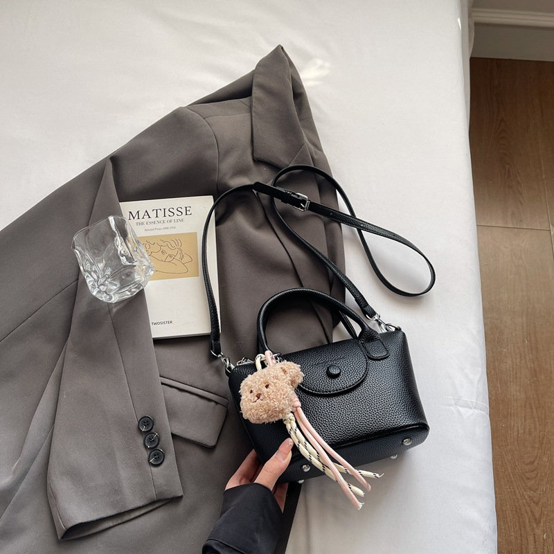 Bolsos pequeños de mano más vendidos de comercio exterior para mujer 2025 nuevo bolso cuadrado pequeño simple y todo fósforo textura casual bolso de mensajero de un solo hombro