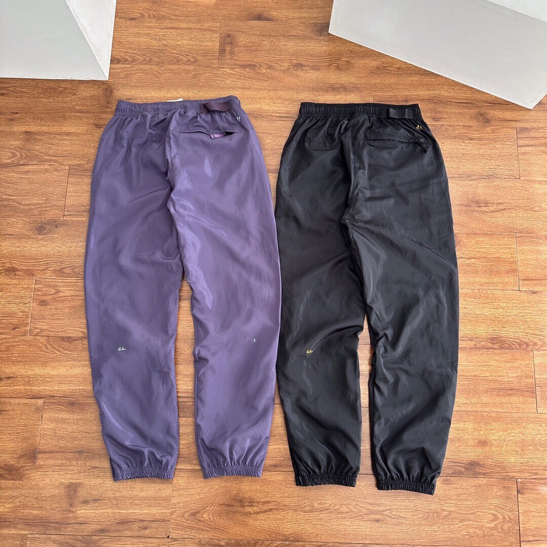 Pantalones deportivos tejidos primavera-verano pareja nuevo nylon rápido secado abrazamiento de pies tejido pantalones deportivos de doble capa para hombre