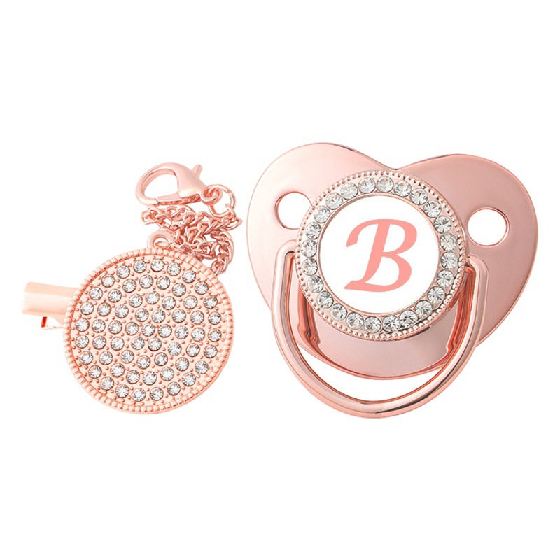 Producto caliente transfronterizo bebé 26 letras de oro rosa calmante pezón destete bebé punto diamante jugar boca con cubierta de polvo
