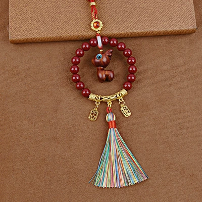 Peace and Prosperity Zakiram Ornament: Car hanging - blood-sandalwood-deer-seeds-colorful-tassels