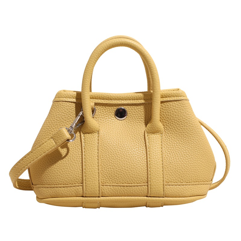 Bolsa de cubo de mano popular de verano para mujeres 2025 nuevo bolso de hombro super caliente universal nicho super caliente mochila