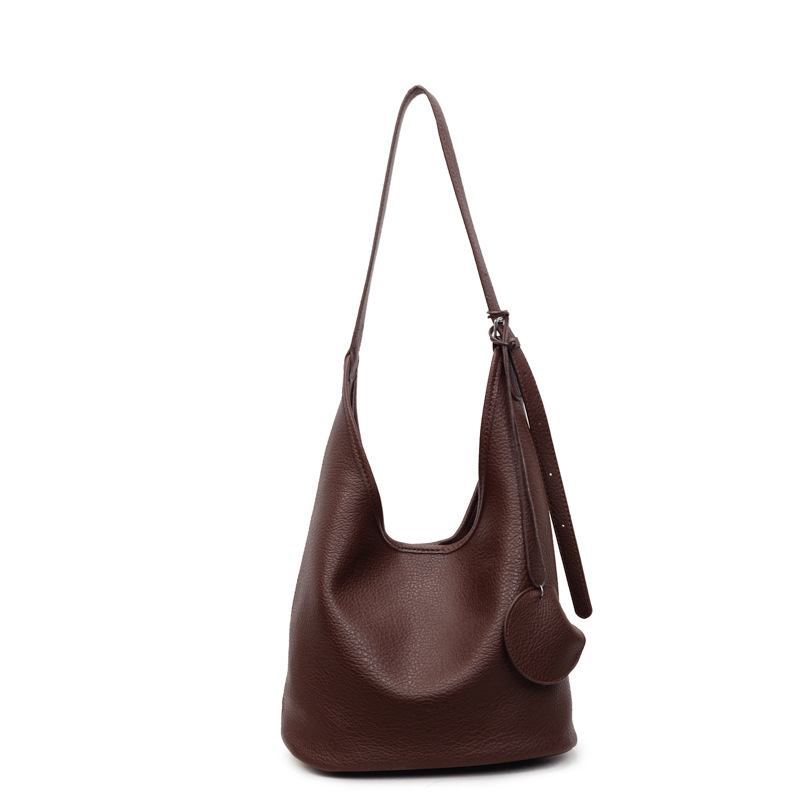 Bolso retro transfronterizo de alta calidad bolso de cubo de agua mujer otoño y invierno 2025 nuevo tipo de bolso de brazo de viaje bolso de hombro universal