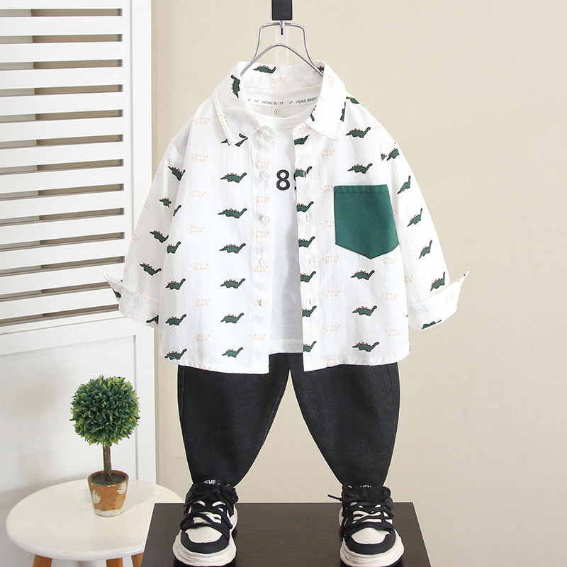6268 Camisa de dinosaurio de dibujos animados para niños Otoño 2025 Nuevo estilo guapo bebé primavera y otoño Camisa de manga larga para niños