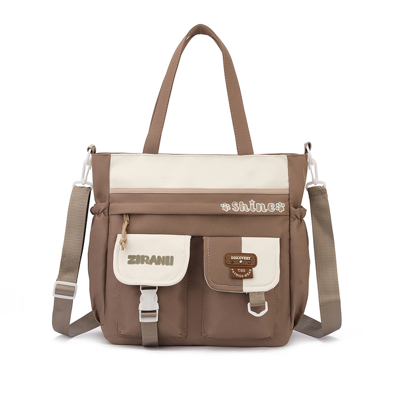Mochila escolar transfronteriza para niñas, versión coreana elegante, gran capacidad, ligera, que reduce la carga y protege la columna vertebral, mochila de doble asa para estudiantes de secundaria.