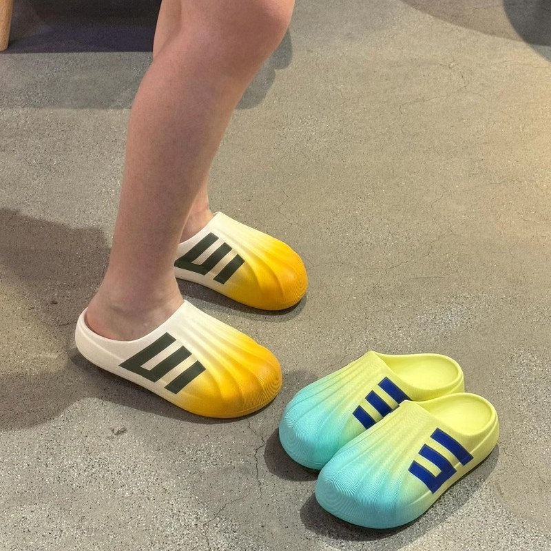 Putian EVA auténtico primavera y otoño nuevo tipo de zapatillas de cabeza de conchas de dopamina para hombres y mujeres zapatillas de agujero de fondo grueso