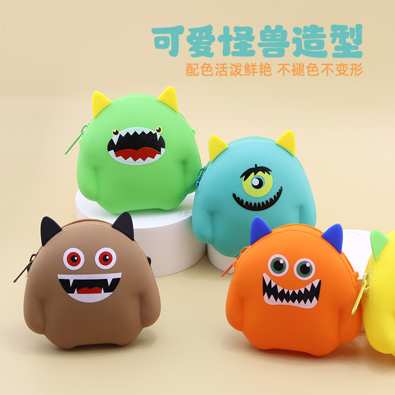 Monstruos de dibujos animados de silicona bolso de cambio de color caramelo cable de datos auriculares bolsa de almacenamiento portátil mini llave bolsa
