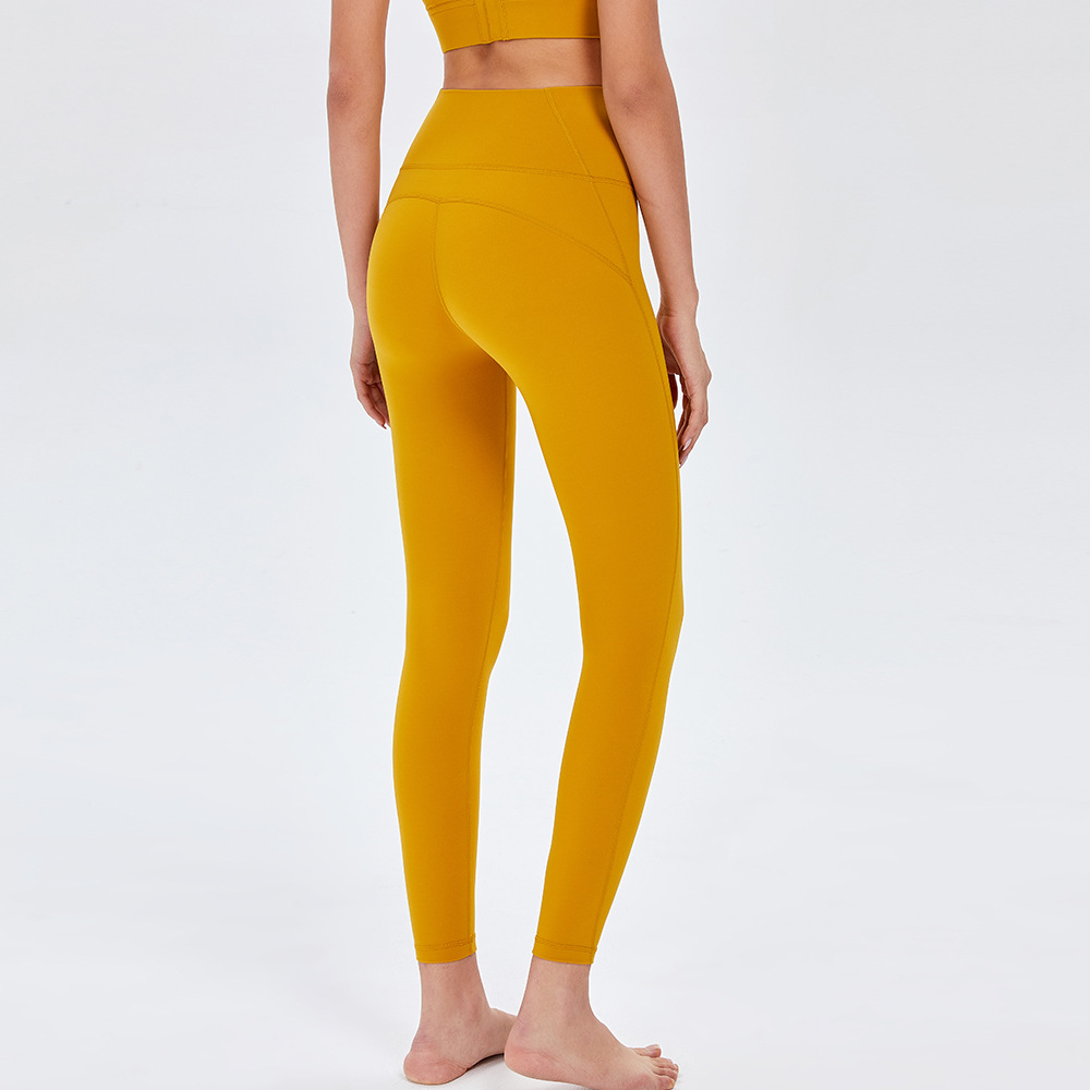 Pantalones de Yoga de cintura alta desnuda europea y americana de las mujeres Peach Hip lifting Pantalones deportivos ajustados pantalones de fitness de secado rápido