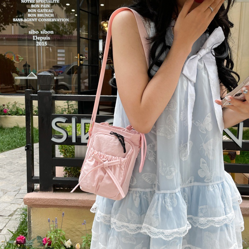 Bolso de teléfono móvil de moda coreana 2025 verano nuevo bolso femenino lindo lazo bolso de hombro bolso de mensajero de lona casual