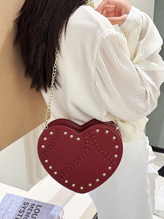 Bolso de mujer verano nuevo bolso en forma de corazón nicho coreano diseño de moda trenzado remaches cadena mochila de hombro