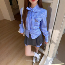 topchanlin 2025早春学院风设计感拼接假两件高腰A字压褶半身短裙