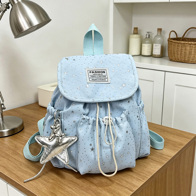 Primavera nuevo estilo ins leche de viento bonito joven estrella impresa mochila de hombro para mujeres de alto valor dulce mochila pequeña