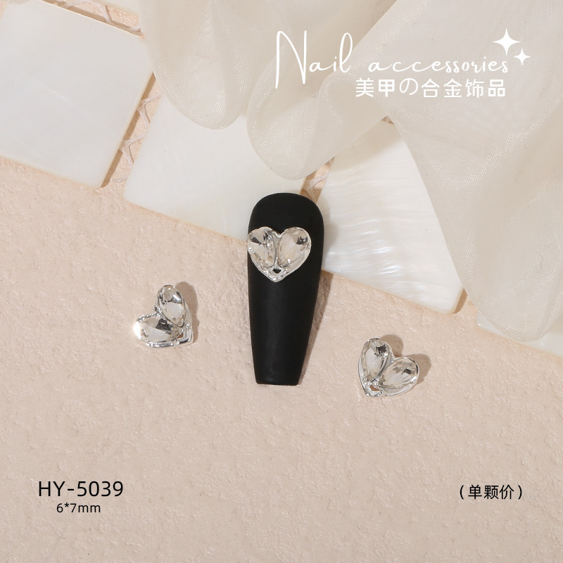 Nuevo arco de uñas amor aleación decoración de uñas flor de la luna mariposa clavo taladro fábrica joyería al por mayor