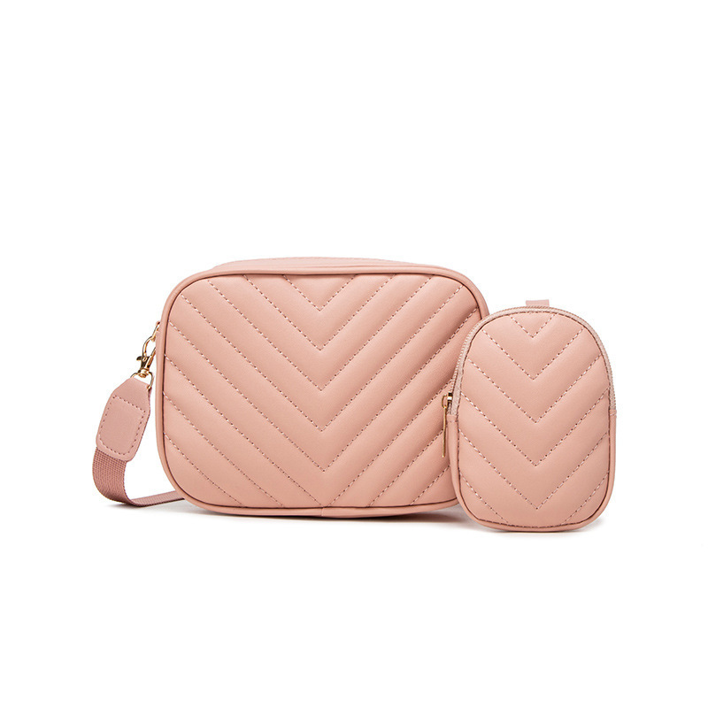 Bolsas de mujer al por mayor transfronterizas 2025 primavera y verano nueva bolsa de moda versátil bolsas de cámara de patrón en V cadena bordada bolsas de mochila