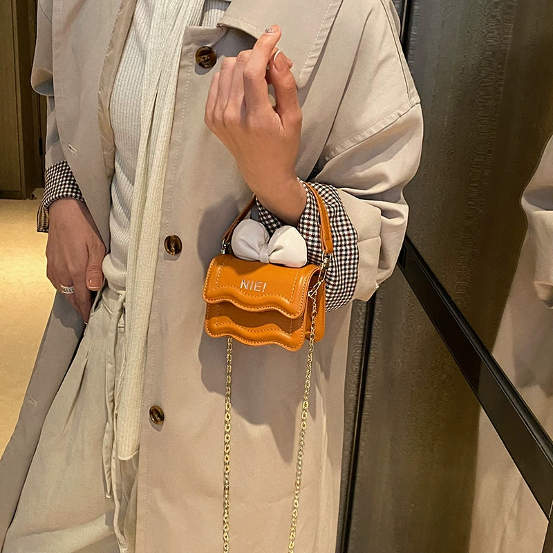 Mini shoulder bag, western style, chain strap, bow detail