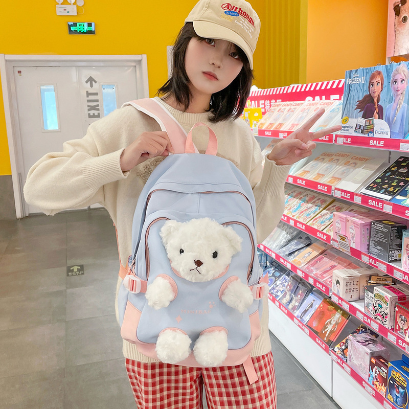 新しいランドセル、女の子、おしゃれな女の子、見栄えの良いリュック、かわいいクマ、中学生、小学生、人形リュック|undefined