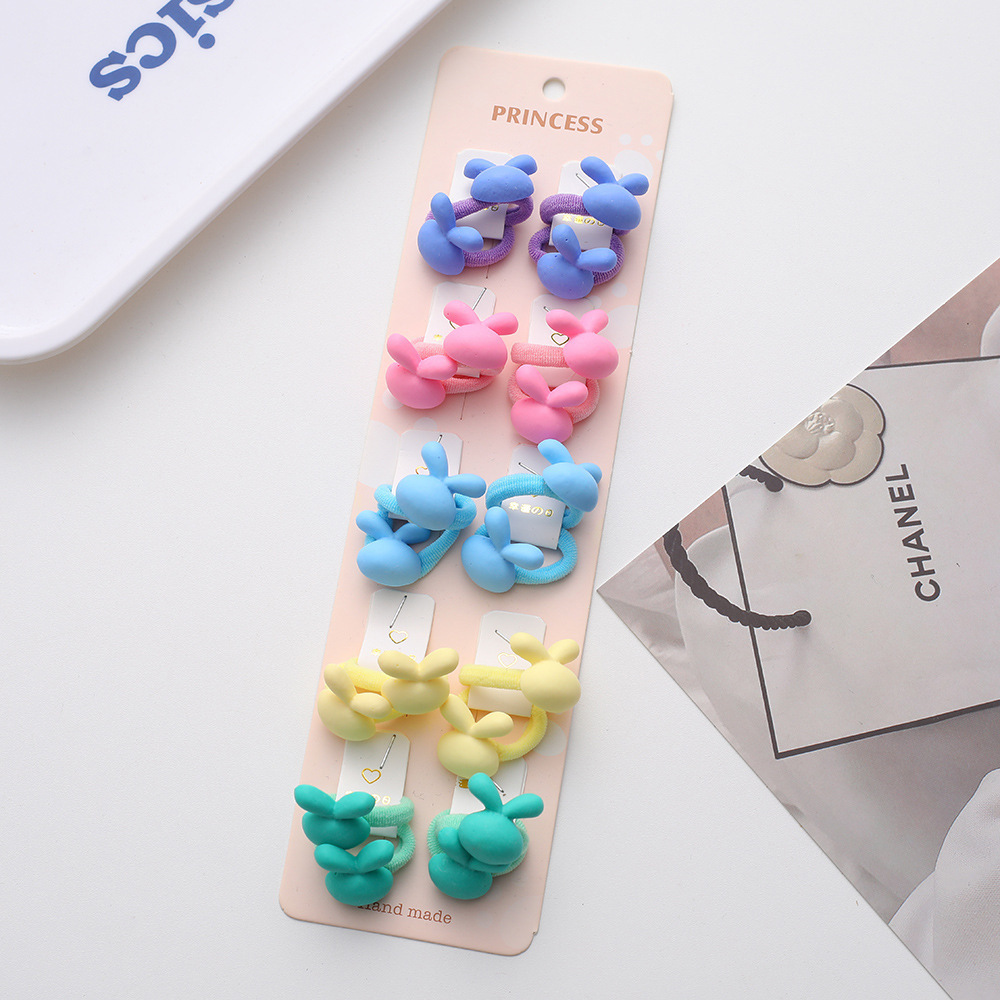 La alta elasticidad de los niños no duele la banda de goma de la cuerda del pelo del bebé de la banda linda del pelo del pulgar de la niña