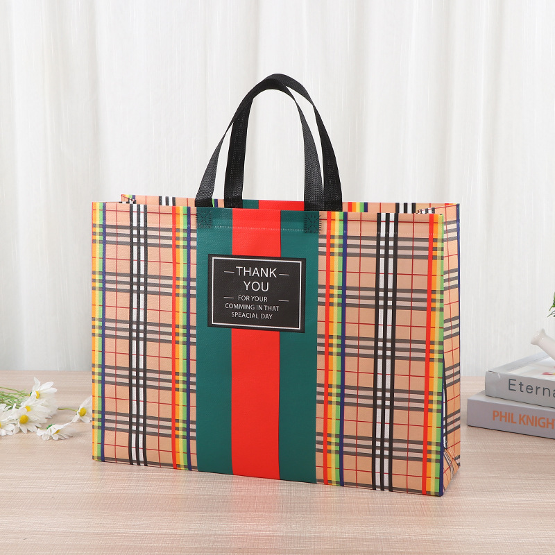 Bolsa de mano no tejida multi-especificación plegable con regalo de mano bolsas de compras de mano logotipo impresa en color bolsas de tela no tejida