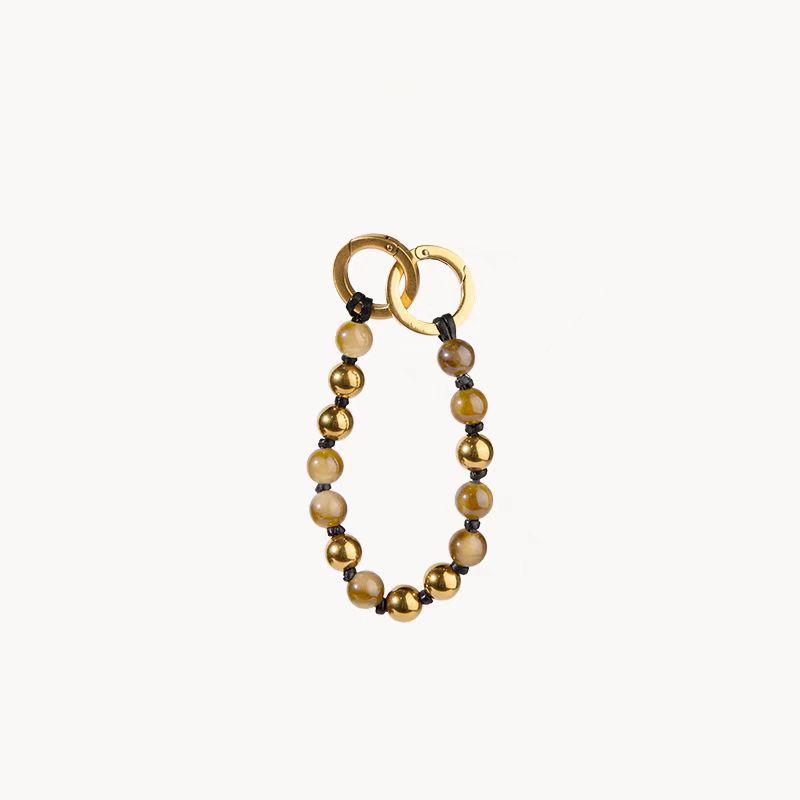 Hay un tubo giratorio de pino, piedra, semillas de Bodhi, calabaza, taza de alivio de preocupaciones