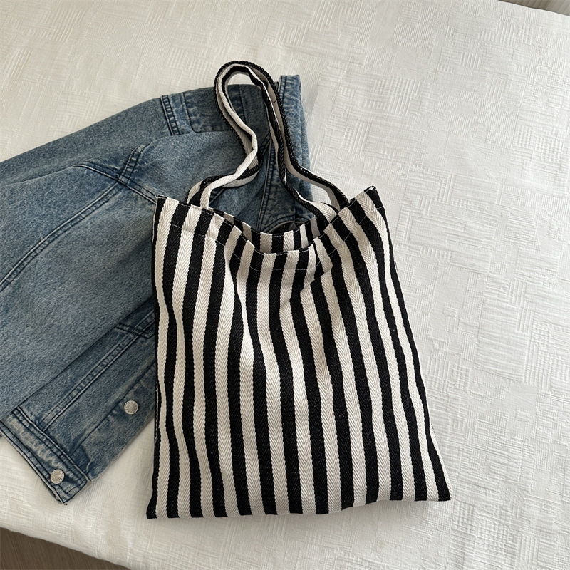 Bolsa de lona a rayas coreana simple bolso de hombro de estudiantes de literatura y arte gran capacidad de lazo bolso de mano