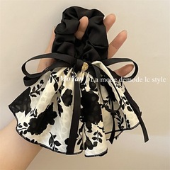 レトロな白黒のプリントの蝶結びの水墨のスカートは輪の紐の女性の高級感の優しい蝶結びの髪の縄の新型を並べます。