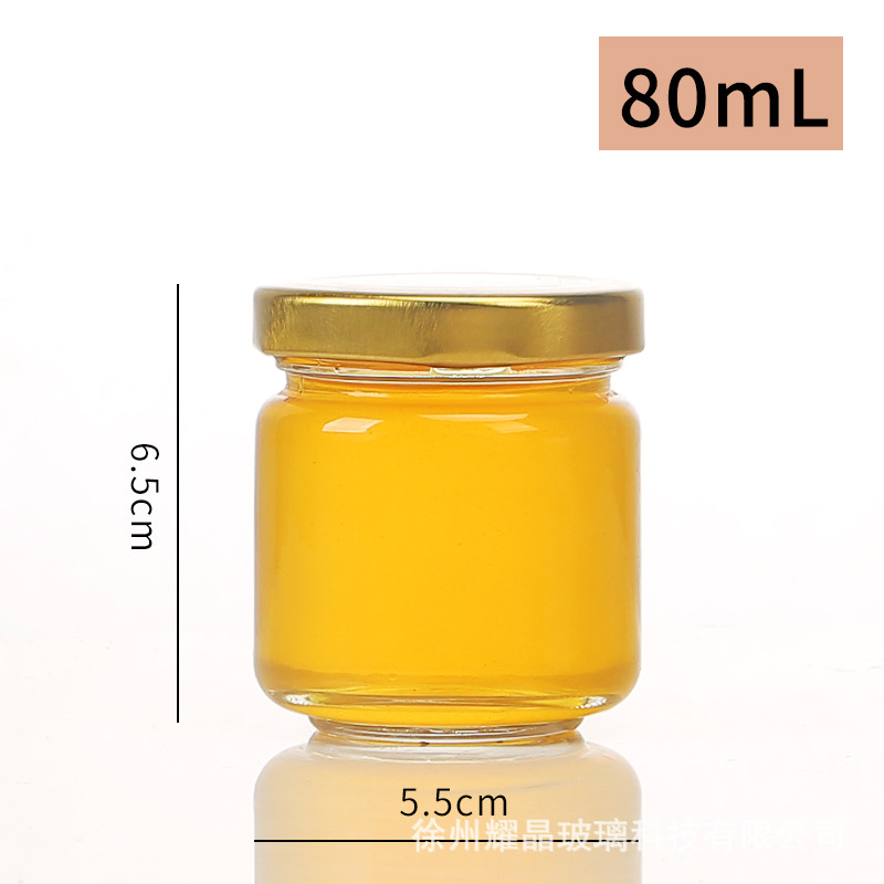 Botella de vidrio redonda de grado alimenticio, botella enlatada transparente sellada, botella de salsa de chile vacía, botella de miel con tapa para cocinar