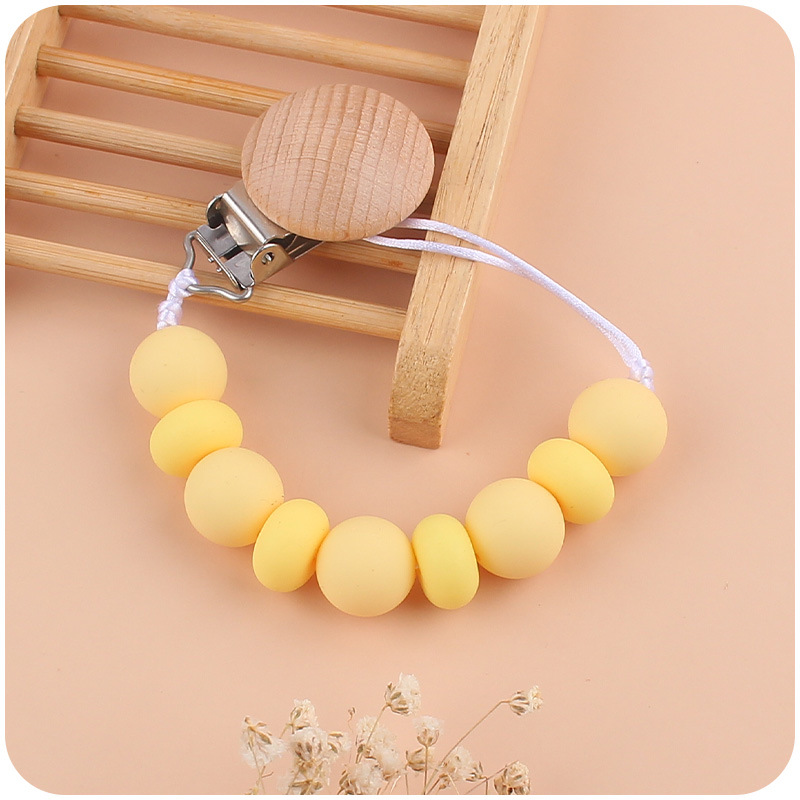 Nuevos suministros para bebés clip de chupete de haya calmante cuentas de silicona para bebés Cuentas planas mordedura Cadena de chupete cuerda anti-caída