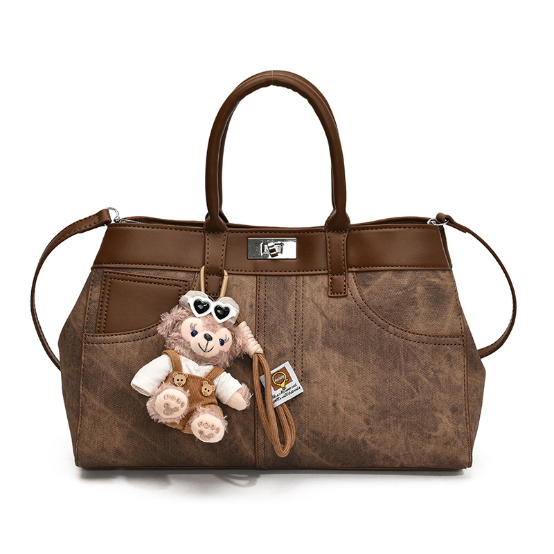 Bolso de mano retro de otoño y invierno para mujeres 2025 nuevo estilo de alta calidad de la bolsa de transporte de viaje empalmado bolso de hombro