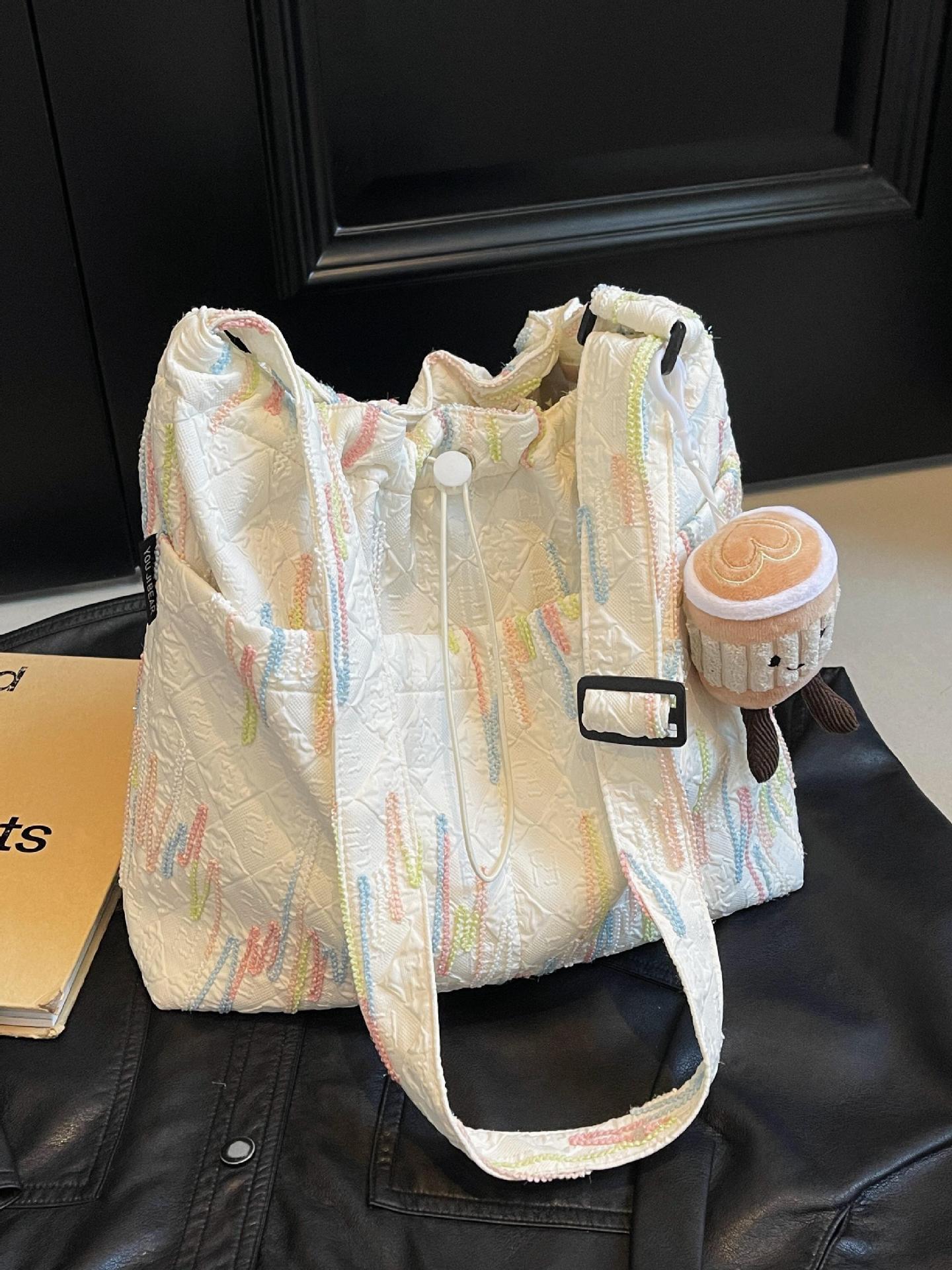 Estilo occidental todo-fósforo bolso de ocio bolso de mensajero mujer 2025 nuevo bolso de cubo de moda simple bolso de lona de viaje para estudiantes