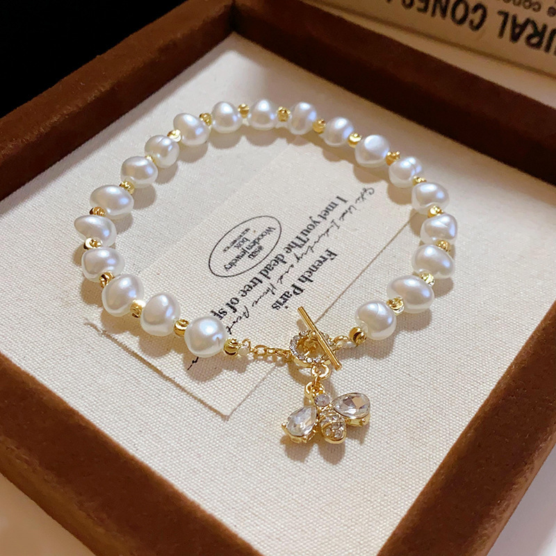 29 # pulsera con botón en T de perla de imitación de abeja