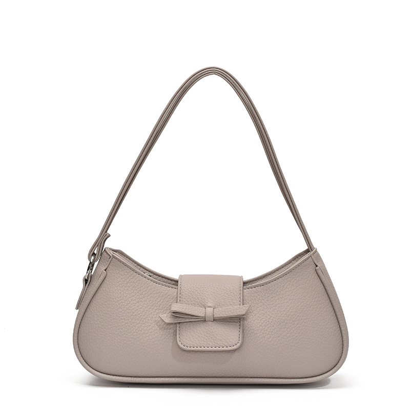 Versión coreana del bolso de axila de nicho 2025 primavera y verano nuevo bolso femenino lindo bolso de lazo bolso de hombro diario