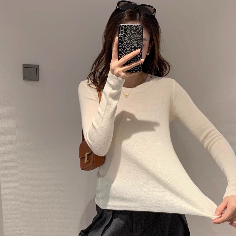 国境を越えて韓国版の秋冬の中で保温して身を修めてやせている気質の長袖のtシャツのニットの女性の上着を現します。|undefined