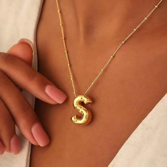 glossy copper pendant with letters