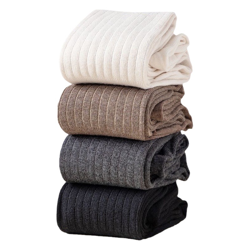 Calcetines de mujer Otoño e Invierno Nuevos calcetines altos color sólido Costura japonesa sobre la rodilla calcetines de pila casual fábrica a juego al por mayor