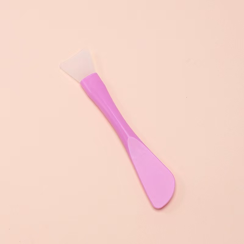 Light purple mask brush with scraper
