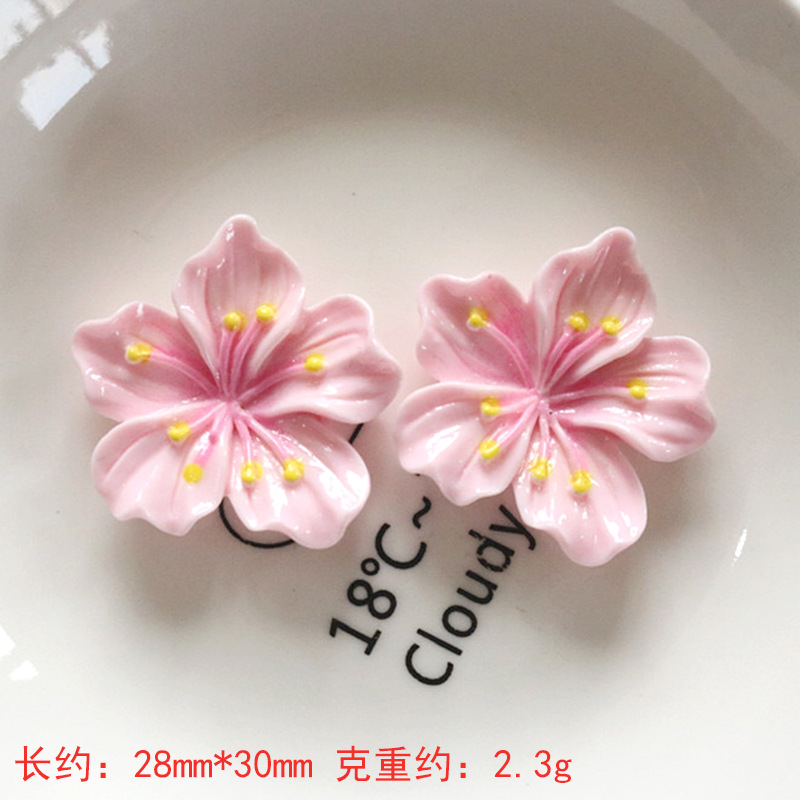 Nuevos accesorios de bricolaje de flor de durazno de resina rosa, zapatos con agujeros de pegamento de crema, fundas para teléfonos móviles, accesorios para el cabello, material de imán para refrigerador al por mayor
