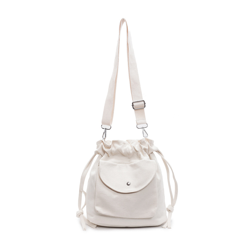 Bolsa de cubo de lona de moda de comercio exterior para mujeres 2025 nuevo estilo versátil bolso de hombro simple ocio nicho plegado mochila