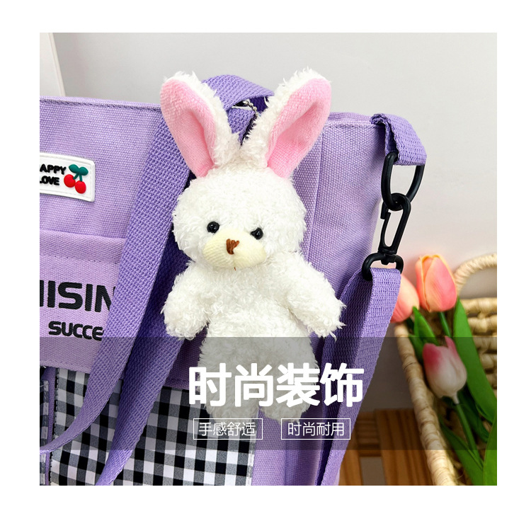 The new Korean-style cute nylon bag for class tutoring is a versatile checkered single-shoulder bag that is selling well (with a bear) undefined