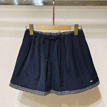 深圳南油2026春女装XSJ1Q05C格纹拼接运动休闲风短半裙S260072