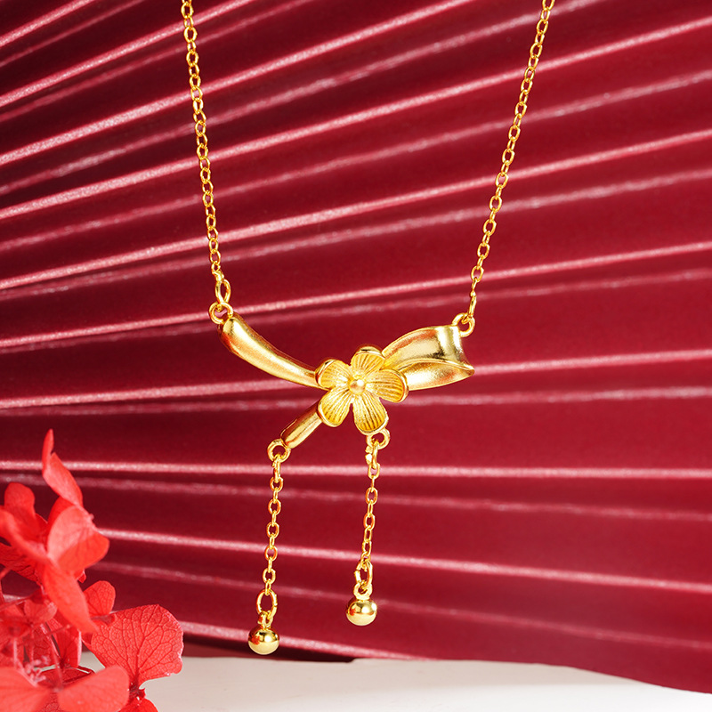 Oro flor arco collar cinta imitación oro borla joyería nicho Luz de lujo todo fósforo temperamento suministro al por mayor