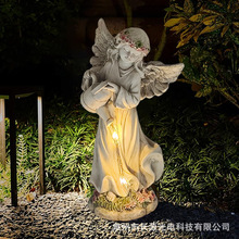 跨境爆款太阳能花园产品天使洒水LED发光庭院装饰摆件树脂工艺品