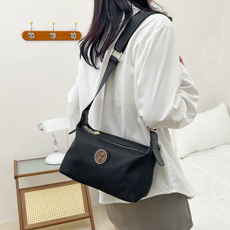 Bolso de mujer de alta calidad universal, nuevo estilo de moda, simple, ligero, elegante, mochila de hombro, mochila de trabajo casual.